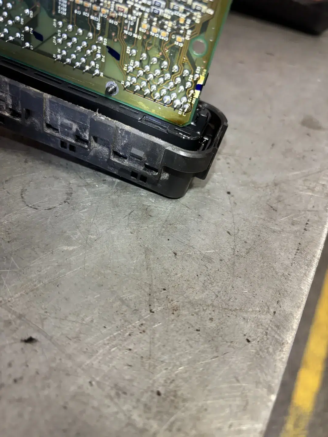Close view of the Eclipse PCM circuit-board edge and black casing