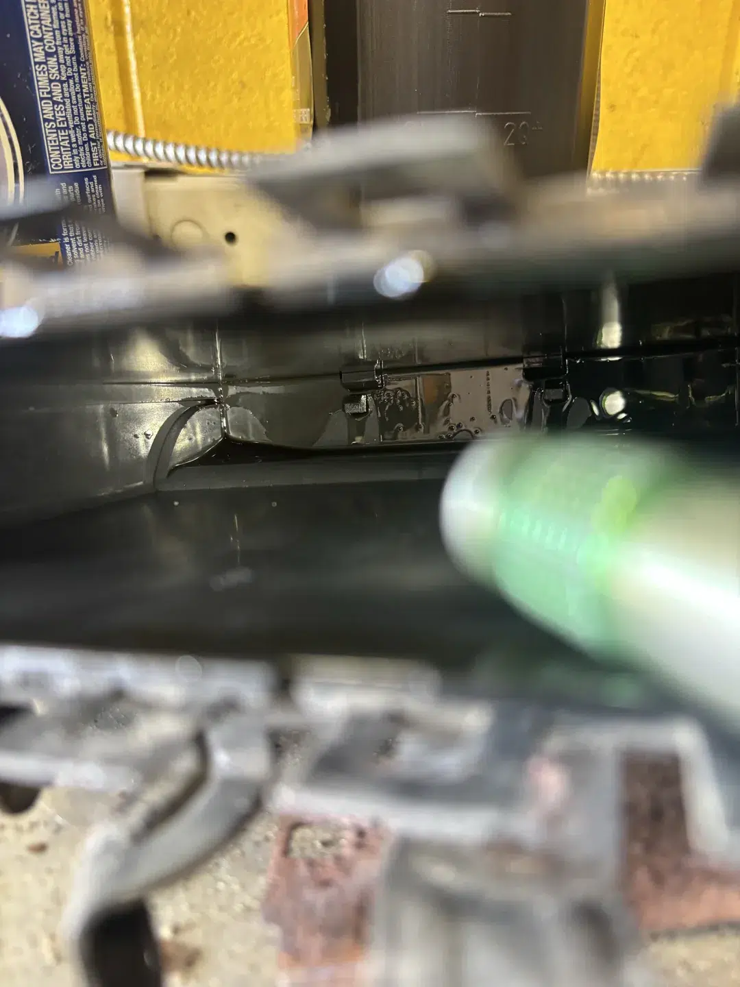 Oil visible inside the opened PCM casing from a 2008 Mitsubishi Eclipse
