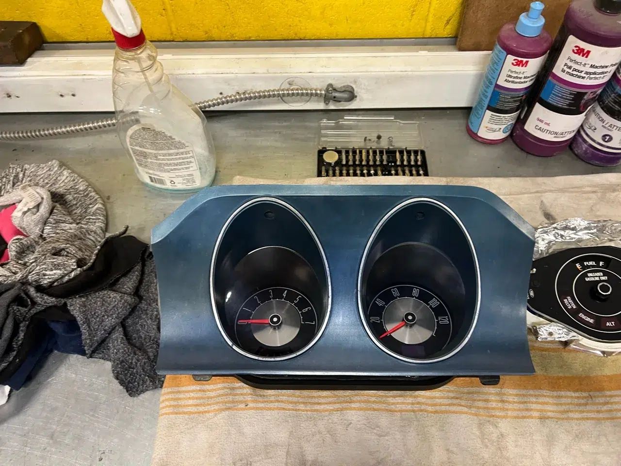 ODG instrument cluster fitted into the Maverick’s blue dashboard bezel on the workbench